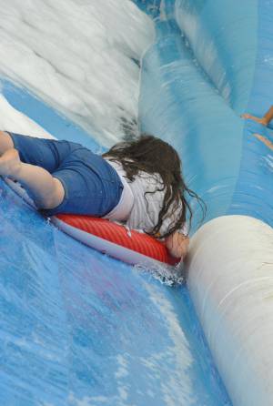 Ilminster Town FC fun day Part 21 – July 9, 2016: A giant water slide was the star attraction at a family fun day held to celebrate Ilminster Town Football Club’s new Archie Gooch Pavilion headquarters in Britten’s Field. Photo 27