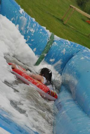 Ilminster Town FC fun day Part 21 – July 9, 2016: A giant water slide was the star attraction at a family fun day held to celebrate Ilminster Town Football Club’s new Archie Gooch Pavilion headquarters in Britten’s Field. Photo 29