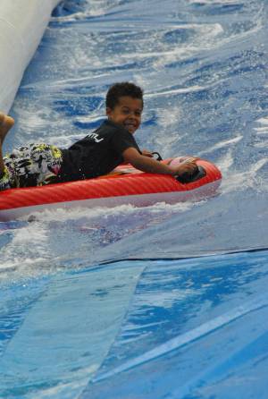 Ilminster Town FC fun day Part 22 – July 9, 2016: A giant water slide was the star attraction at a family fun day held to celebrate Ilminster Town Football Club’s new Archie Gooch Pavilion headquarters in Britten’s Field. Photo 12