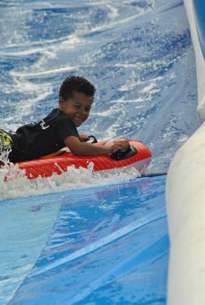 Ilminster Town FC fun day Part 22 – July 9, 2016: A giant water slide was the star attraction at a family fun day held to celebrate Ilminster Town Football Club’s new Archie Gooch Pavilion headquarters in Britten’s Field. Photo 13