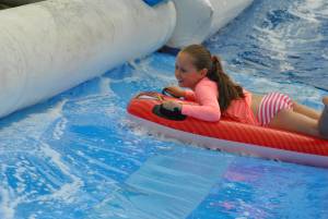 Ilminster Town FC fun day Part 22 – July 9, 2016: A giant water slide was the star attraction at a family fun day held to celebrate Ilminster Town Football Club’s new Archie Gooch Pavilion headquarters in Britten’s Field. Photo 14