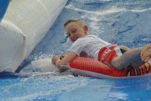 Ilminster Town FC fun day Part 22 – July 9, 2016: A giant water slide was the star attraction at a family fun day held to celebrate Ilminster Town Football Club’s new Archie Gooch Pavilion headquarters in Britten’s Field. Photo 17