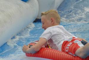 Ilminster Town FC fun day Part 22 – July 9, 2016: A giant water slide was the star attraction at a family fun day held to celebrate Ilminster Town Football Club’s new Archie Gooch Pavilion headquarters in Britten’s Field. Photo 18