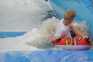 Ilminster Town FC fun day Part 22 – July 9, 2016: A giant water slide was the star attraction at a family fun day held to celebrate Ilminster Town Football Club’s new Archie Gooch Pavilion headquarters in Britten’s Field. Photo 19
