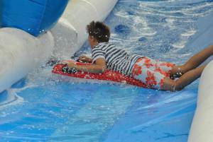 Ilminster Town FC fun day Part 22 – July 9, 2016: A giant water slide was the star attraction at a family fun day held to celebrate Ilminster Town Football Club’s new Archie Gooch Pavilion headquarters in Britten’s Field. Photo 21
