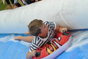 Ilminster Town FC fun day Part 22 – July 9, 2016: A giant water slide was the star attraction at a family fun day held to celebrate Ilminster Town Football Club’s new Archie Gooch Pavilion headquarters in Britten’s Field. Photo 22