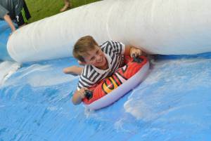 Ilminster Town FC fun day Part 22 – July 9, 2016: A giant water slide was the star attraction at a family fun day held to celebrate Ilminster Town Football Club’s new Archie Gooch Pavilion headquarters in Britten’s Field. Photo 23