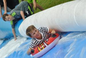Ilminster Town FC fun day Part 22 – July 9, 2016: A giant water slide was the star attraction at a family fun day held to celebrate Ilminster Town Football Club’s new Archie Gooch Pavilion headquarters in Britten’s Field. Photo 24
