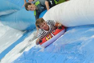 Ilminster Town FC fun day Part 22 – July 9, 2016: A giant water slide was the star attraction at a family fun day held to celebrate Ilminster Town Football Club’s new Archie Gooch Pavilion headquarters in Britten’s Field. Photo 25