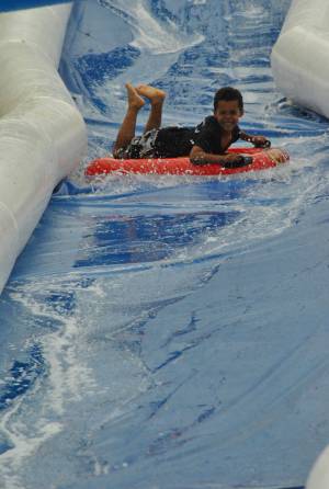 Ilminster Town FC fun day Part 22 – July 9, 2016: A giant water slide was the star attraction at a family fun day held to celebrate Ilminster Town Football Club’s new Archie Gooch Pavilion headquarters in Britten’s Field. Photo 26