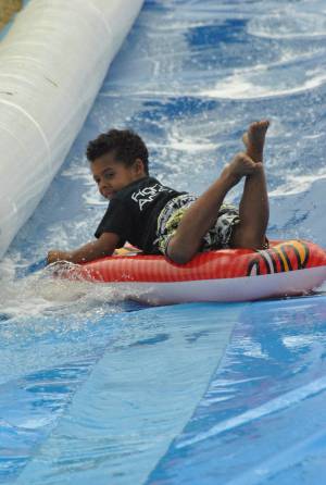 Ilminster Town FC fun day Part 22 – July 9, 2016: A giant water slide was the star attraction at a family fun day held to celebrate Ilminster Town Football Club’s new Archie Gooch Pavilion headquarters in Britten’s Field. Photo 27