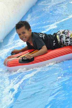 Ilminster Town FC fun day Part 22 – July 9, 2016: A giant water slide was the star attraction at a family fun day held to celebrate Ilminster Town Football Club’s new Archie Gooch Pavilion headquarters in Britten’s Field. Photo 28