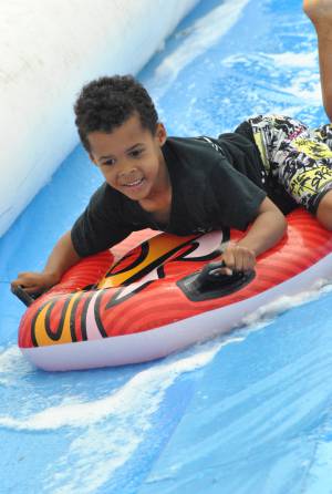 Ilminster Town FC fun day Part 22 – July 9, 2016: A giant water slide was the star attraction at a family fun day held to celebrate Ilminster Town Football Club’s new Archie Gooch Pavilion headquarters in Britten’s Field. Photo 29