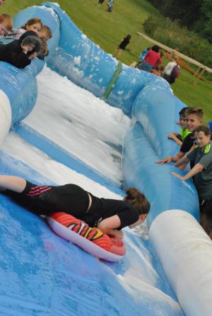 Ilminster Town FC fun day Part 22 – July 9, 2016: A giant water slide was the star attraction at a family fun day held to celebrate Ilminster Town Football Club’s new Archie Gooch Pavilion headquarters in Britten’s Field. Photo 5