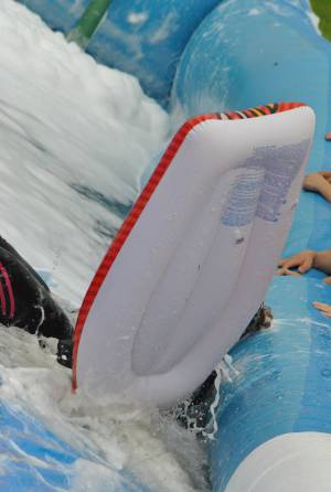 Ilminster Town FC fun day Part 22 – July 9, 2016: A giant water slide was the star attraction at a family fun day held to celebrate Ilminster Town Football Club’s new Archie Gooch Pavilion headquarters in Britten’s Field. Photo 6
