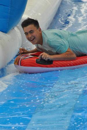 Ilminster Town FC fun day Part 22 – July 9, 2016: A giant water slide was the star attraction at a family fun day held to celebrate Ilminster Town Football Club’s new Archie Gooch Pavilion headquarters in Britten’s Field. Photo 7
