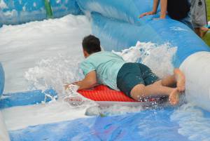 Ilminster Town FC fun day Part 22 – July 9, 2016: A giant water slide was the star attraction at a family fun day held to celebrate Ilminster Town Football Club’s new Archie Gooch Pavilion headquarters in Britten’s Field. Photo 8