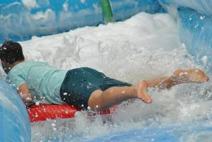 Ilminster Town FC fun day Part 22 – July 9, 2016: A giant water slide was the star attraction at a family fun day held to celebrate Ilminster Town Football Club’s new Archie Gooch Pavilion headquarters in Britten’s Field. Photo 9
