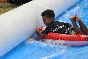 Ilminster Town FC fun day Part 23 – July 9, 2016: A giant water slide was the star attraction at a family fun day held to celebrate Ilminster Town Football Club’s new Archie Gooch Pavilion headquarters in Britten’s Field. Photo 14