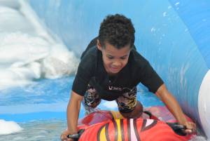 Ilminster Town FC fun day Part 23 – July 9, 2016: A giant water slide was the star attraction at a family fun day held to celebrate Ilminster Town Football Club’s new Archie Gooch Pavilion headquarters in Britten’s Field. Photo 15