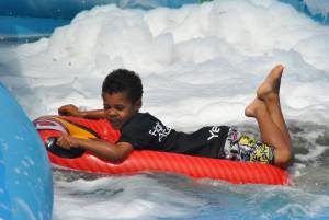 Ilminster Town FC fun day Part 23 – July 9, 2016: A giant water slide was the star attraction at a family fun day held to celebrate Ilminster Town Football Club’s new Archie Gooch Pavilion headquarters in Britten’s Field. Photo 16
