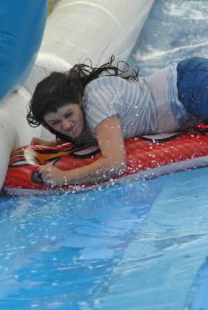 Ilminster Town FC fun day Part 23 – July 9, 2016: A giant water slide was the star attraction at a family fun day held to celebrate Ilminster Town Football Club’s new Archie Gooch Pavilion headquarters in Britten’s Field. Photo 1