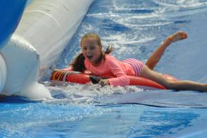 Ilminster Town FC fun day Part 23 – July 9, 2016: A giant water slide was the star attraction at a family fun day held to celebrate Ilminster Town Football Club’s new Archie Gooch Pavilion headquarters in Britten’s Field. Photo 18