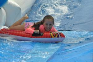 Ilminster Town FC fun day Part 23 – July 9, 2016: A giant water slide was the star attraction at a family fun day held to celebrate Ilminster Town Football Club’s new Archie Gooch Pavilion headquarters in Britten’s Field. Photo 19