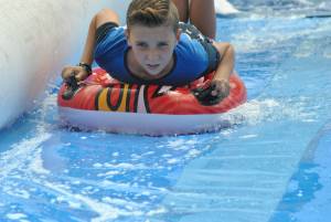 Ilminster Town FC fun day Part 23 – July 9, 2016: A giant water slide was the star attraction at a family fun day held to celebrate Ilminster Town Football Club’s new Archie Gooch Pavilion headquarters in Britten’s Field. Photo 21