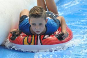 Ilminster Town FC fun day Part 23 – July 9, 2016: A giant water slide was the star attraction at a family fun day held to celebrate Ilminster Town Football Club’s new Archie Gooch Pavilion headquarters in Britten’s Field. Photo 22