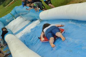 Ilminster Town FC fun day Part 23 – July 9, 2016: A giant water slide was the star attraction at a family fun day held to celebrate Ilminster Town Football Club’s new Archie Gooch Pavilion headquarters in Britten’s Field. Photo 2