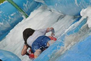 Ilminster Town FC fun day Part 23 – July 9, 2016: A giant water slide was the star attraction at a family fun day held to celebrate Ilminster Town Football Club’s new Archie Gooch Pavilion headquarters in Britten’s Field. Photo 4