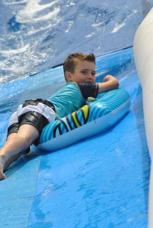 Ilminster Town FC fun day Part 23 – July 9, 2016: A giant water slide was the star attraction at a family fun day held to celebrate Ilminster Town Football Club’s new Archie Gooch Pavilion headquarters in Britten’s Field. Photo 5