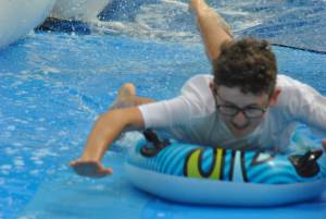 Ilminster Town FC fun day Part 24 – July 9, 2016: A giant water slide was the star attraction at a family fun day held to celebrate Ilminster Town Football Club’s new Archie Gooch Pavilion headquarters in Britten’s Field. Photo 21