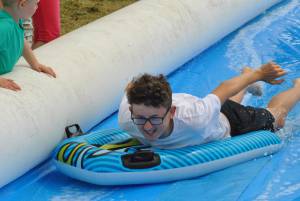 Ilminster Town FC fun day Part 24 – July 9, 2016: A giant water slide was the star attraction at a family fun day held to celebrate Ilminster Town Football Club’s new Archie Gooch Pavilion headquarters in Britten’s Field. Photo 22
