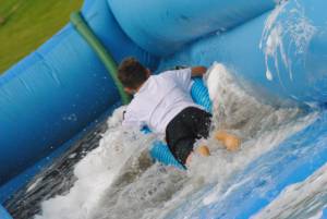 Ilminster Town FC fun day Part 24 – July 9, 2016: A giant water slide was the star attraction at a family fun day held to celebrate Ilminster Town Football Club’s new Archie Gooch Pavilion headquarters in Britten’s Field. Photo 24
