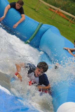 Ilminster Town FC fun day Part 24 – July 9, 2016: A giant water slide was the star attraction at a family fun day held to celebrate Ilminster Town Football Club’s new Archie Gooch Pavilion headquarters in Britten’s Field. Photo 28