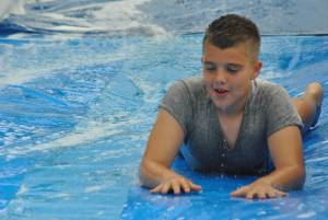 Ilminster Town FC fun day Part 25 – July 9, 2016: A giant water slide was the star attraction at a family fun day held to celebrate Ilminster Town Football Club’s new Archie Gooch Pavilion headquarters in Britten’s Field. Photo 10
