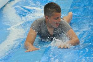 Ilminster Town FC fun day Part 25 – July 9, 2016: A giant water slide was the star attraction at a family fun day held to celebrate Ilminster Town Football Club’s new Archie Gooch Pavilion headquarters in Britten’s Field. Photo 11