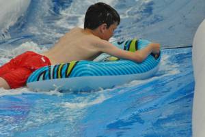 Ilminster Town FC fun day Part 25 – July 9, 2016: A giant water slide was the star attraction at a family fun day held to celebrate Ilminster Town Football Club’s new Archie Gooch Pavilion headquarters in Britten’s Field. Photo 12