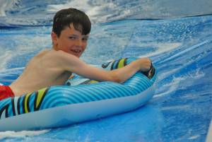 Ilminster Town FC fun day Part 25 – July 9, 2016: A giant water slide was the star attraction at a family fun day held to celebrate Ilminster Town Football Club’s new Archie Gooch Pavilion headquarters in Britten’s Field. Photo 13