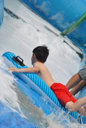 Ilminster Town FC fun day Part 25 – July 9, 2016: A giant water slide was the star attraction at a family fun day held to celebrate Ilminster Town Football Club’s new Archie Gooch Pavilion headquarters in Britten’s Field. Photo 14