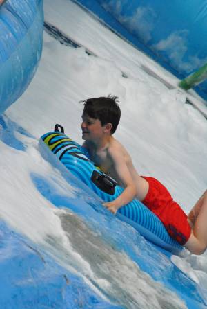 Ilminster Town FC fun day Part 25 – July 9, 2016: A giant water slide was the star attraction at a family fun day held to celebrate Ilminster Town Football Club’s new Archie Gooch Pavilion headquarters in Britten’s Field. Photo 15