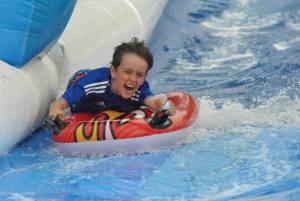 Ilminster Town FC fun day Part 25 – July 9, 2016: A giant water slide was the star attraction at a family fun day held to celebrate Ilminster Town Football Club’s new Archie Gooch Pavilion headquarters in Britten’s Field. Photo 17