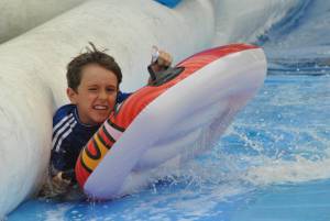 Ilminster Town FC fun day Part 25 – July 9, 2016: A giant water slide was the star attraction at a family fun day held to celebrate Ilminster Town Football Club’s new Archie Gooch Pavilion headquarters in Britten’s Field. Photo 18