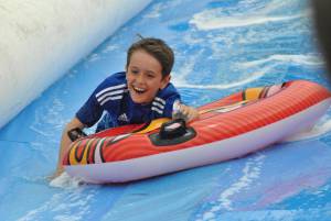 Ilminster Town FC fun day Part 25 – July 9, 2016: A giant water slide was the star attraction at a family fun day held to celebrate Ilminster Town Football Club’s new Archie Gooch Pavilion headquarters in Britten’s Field. Photo 19
