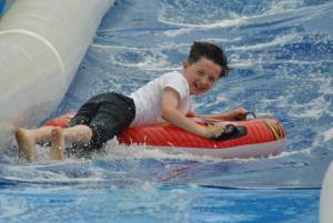 Ilminster Town FC fun day Part 25 – July 9, 2016: A giant water slide was the star attraction at a family fun day held to celebrate Ilminster Town Football Club’s new Archie Gooch Pavilion headquarters in Britten’s Field. Photo 20