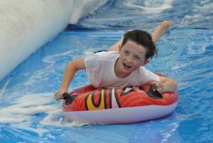 Ilminster Town FC fun day Part 25 – July 9, 2016: A giant water slide was the star attraction at a family fun day held to celebrate Ilminster Town Football Club’s new Archie Gooch Pavilion headquarters in Britten’s Field. Photo 22