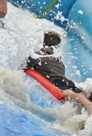Ilminster Town FC fun day Part 25 – July 9, 2016: A giant water slide was the star attraction at a family fun day held to celebrate Ilminster Town Football Club’s new Archie Gooch Pavilion headquarters in Britten’s Field. Photo 26