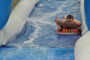 Ilminster Town FC fun day Part 25 – July 9, 2016: A giant water slide was the star attraction at a family fun day held to celebrate Ilminster Town Football Club’s new Archie Gooch Pavilion headquarters in Britten’s Field. Photo 27